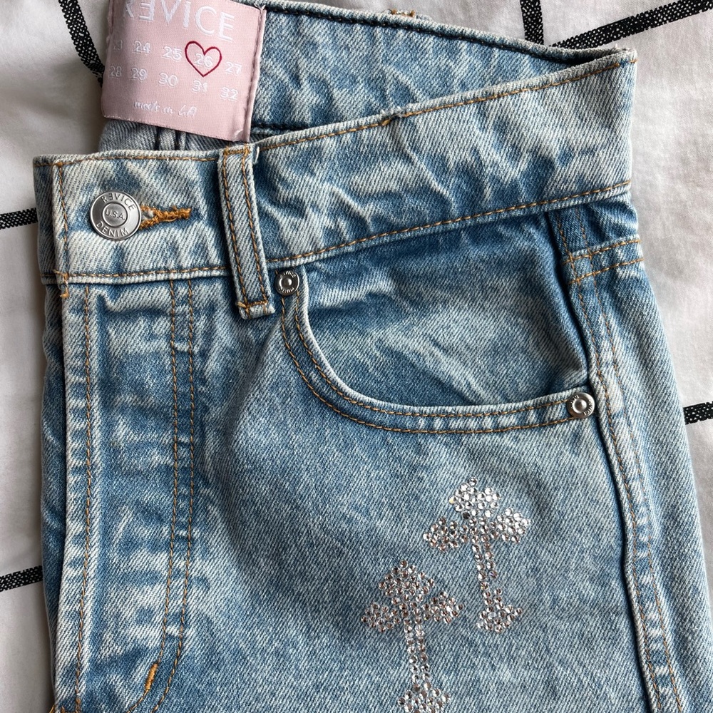 Revice bedazzling cross jeans steaight leg with butt rip